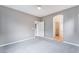 A bright bedroom with soft carpet, neutral walls, and ensuite bathroom at 9303 Gilcrease Ave # 1013, Las Vegas, NV 89149