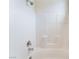Modern shower with white tile, chrome fixtures, and a convenient built-in seat at 9303 Gilcrease Ave # 1013, Las Vegas, NV 89149