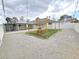 Gravel backyard with grass and wood structure, offering outdoor allure at 1021 Wengert Ave, Las Vegas, NV 89104