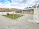 Backyard features gravel and grass with a wood structure, offering outdoor appeal at 1021 Wengert Ave, Las Vegas, NV 89104