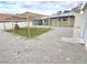 Backyard features gravel and grass with a wood structure, offering outdoor appeal at 1021 Wengert Ave, Las Vegas, NV 89104