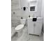 Modern bathroom featuring a shower and sleek vanity with stylish mirror at 1021 Wengert Ave, Las Vegas, NV 89104