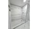 Modern shower features white wall tiles with black and white mosaic floor at 1021 Wengert Ave, Las Vegas, NV 89104