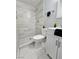 Contemporary bathroom featuring a tiled shower and modern white vanity at 1021 Wengert Ave, Las Vegas, NV 89104