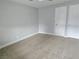 Spacious bedroom with neutral carpeting and two closet doors at 1021 Wengert Ave, Las Vegas, NV 89104