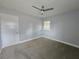 Carpeted bedroom featuring neutral walls, a ceiling fan, and a window at 1021 Wengert Ave, Las Vegas, NV 89104