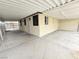 Wide carport showcasing textured walls, shaded parking and secure gate at 1021 Wengert Ave, Las Vegas, NV 89104