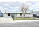 Charming single-story home featuring a fenced front yard with low maintenance landscaping and a gray exterior at 1021 Wengert Ave, Las Vegas, NV 89104