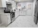 Bright kitchen features stainless steel appliances, modern countertops, and white cabinets for a clean aesthetic at 1021 Wengert Ave, Las Vegas, NV 89104