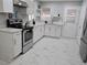 Bright kitchen features stainless steel appliances, modern countertops, and white cabinets for a clean aesthetic at 1021 Wengert Ave, Las Vegas, NV 89104