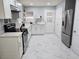Bright kitchen features stainless steel appliances, modern countertops, white cabinets, and stylish backsplash at 1021 Wengert Ave, Las Vegas, NV 89104