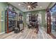 Spacious bonus room designed for entertainment, featuring display cases and guitars for a personalized living space at 12121 Cabo Rojo Ave, Las Vegas, NV 89138