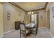 Charming dining room boasting a tray ceiling, chandelier, and neutral color palette perfect for intimate gatherings at 12121 Cabo Rojo Ave, Las Vegas, NV 89138