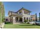 Expansive backyard featuring a luxurious home, and pristine landscaping at 12121 Cabo Rojo Ave, Las Vegas, NV 89138