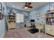 Inviting home office with blue walls, a charming desk, and built-in bookcases for productivity and organization at 12121 Cabo Rojo Ave, Las Vegas, NV 89138