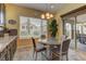 Bright kitchen nook with chandelier lighting and sliding glass doors providing seamless access to the back yard at 12121 Cabo Rojo Ave, Las Vegas, NV 89138