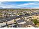 An aerial view of the property and neighborhood showcasing the home's location, nearby streets, and city views at 1225 Arrowhead Ave, Las Vegas, NV 89106