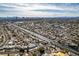 An aerial view of the home and neighborhood showcasing the city's layout and proximity to the city skyline at 1225 Arrowhead Ave, Las Vegas, NV 89106