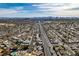 Expansive aerial view of a Las Vegas neighborhood with city skyline and mountain views, showcasing the community's location at 1225 Arrowhead Ave, Las Vegas, NV 89106