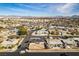 A distant view of the home shows its surroundings and access to nearby streets in the neighborhood at 1225 Arrowhead Ave, Las Vegas, NV 89106