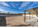 Spacious backyard featuring a blank canvas with a covered patio and block fencing at 1225 Arrowhead Ave, Las Vegas, NV 89106