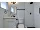 Bathroom featuring white vanity, a mirror and a shower with white subway tiles at 1225 Arrowhead Ave, Las Vegas, NV 89106