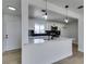 Stylish kitchen with white cabinets, stainless steel appliances, black subway tile backsplash, and an island at 1225 Arrowhead Ave, Las Vegas, NV 89106