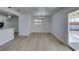 Bright living room features new floors, modern lighting, fresh paint, and an open layout to the kitchen at 1225 Arrowhead Ave, Las Vegas, NV 89106