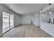 Spacious living room boasts new floors, fresh paint, and an open layout to the kitchen at 1225 Arrowhead Ave, Las Vegas, NV 89106