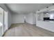 Spacious living room boasts new floors, fresh paint, and an open layout to the kitchen at 1225 Arrowhead Ave, Las Vegas, NV 89106