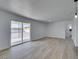 Spacious living room boasts new floors, fresh paint, and sliding glass doors leading to the backyard at 1225 Arrowhead Ave, Las Vegas, NV 89106