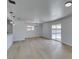 Living area showcasing new floors, updated fixtures, and natural light with kitchen view at 1225 Arrowhead Ave, Las Vegas, NV 89106