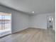A light and airy living room featuring modern light fixtures and an open floor plan at 1225 Arrowhead Ave, Las Vegas, NV 89106