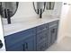 Bathroom featuring double sinks, blue vanity and modern fixtures at 1624 N Torrey Pines Dr # 101, Las Vegas, NV 89108