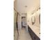 Bathroom featuring double sinks, walk-in shower, and new fixtures at 1624 N Torrey Pines Dr # 101, Las Vegas, NV 89108