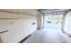 Spacious garage interior with shelving and ample room for vehicle and storage at 1624 N Torrey Pines Dr # 101, Las Vegas, NV 89108