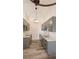 Stylish kitchen featuring gray cabinets, new countertops, and modern lighting at 1624 N Torrey Pines Dr # 101, Las Vegas, NV 89108