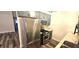 Renovated kitchen features stainless steel appliances, gray cabinets and stone countertops at 1624 N Torrey Pines Dr # 101, Las Vegas, NV 89108
