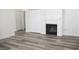 Living room featuring a fireplace and luxury vinyl plank flooring at 1624 N Torrey Pines Dr # 101, Las Vegas, NV 89108