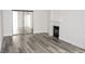 Living room with sliding mirror closet doors and a fireplace at 1624 N Torrey Pines Dr # 101, Las Vegas, NV 89108