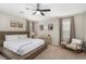 Comfortable and serene bedroom suite offers carpeted floors, neutral walls, and plenty of natural light at 1838 Classic Novel St, Las Vegas, NV 89115