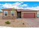 Charming single-story home with a brick driveway and a desert landscape at 1838 Classic Novel St, Las Vegas, NV 89115