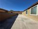 Spacious backyard featuring a concrete patio and desert landscaping for outdoor living and entertaining at 2040 Port Royal Dr, Laughlin, NV 89029