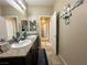 Well-lit bathroom features double sinks, granite countertops, and a decorative nautical theme at 2040 Port Royal Dr, Laughlin, NV 89029