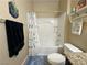 Bathroom featuring a shower over tub combo, and a toilet, providing a functional space at 2040 Port Royal Dr, Laughlin, NV 89029