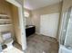 Bathroom with double sinks, tiled floor, shower, and toilet at 2040 Port Royal Dr, Laughlin, NV 89029