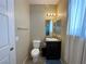 Bathroom with a single sink vanity, drawers, mirror, and toilet at 2040 Port Royal Dr, Laughlin, NV 89029