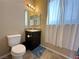 Cozy bathroom featuring a toilet and vanity with sink and a mirror at 2040 Port Royal Dr, Laughlin, NV 89029