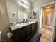 Bathroom showcasing double sinks, and a toilet, providing a functional space at 2040 Port Royal Dr, Laughlin, NV 89029