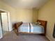 Bedroom features neutral-toned walls, carpet, and wood furniture at 2040 Port Royal Dr, Laughlin, NV 89029